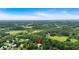 Aerial view highlighting the property's location amid rolling hills and lush greenery at 33 Moriah Ne Way, Rydal, GA 30171