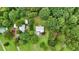 Lush, secluded property with a home, mature trees, outbuildings, and greenery at 33 Moriah Ne Way, Rydal, GA 30171