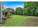 This large backyard features a grassy lawn and a wooden deck at 33 Moriah Ne Way, Rydal, GA 30171