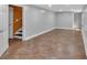 This finished basement has gray walls, recessed lighting and tile floors at 33 Moriah Ne Way, Rydal, GA 30171