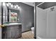 Modern bathroom with a vanity sink, mirror, and a walk-in shower at 33 Moriah Ne Way, Rydal, GA 30171