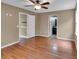 A large bedroom boasting hardwood floors and ensuite bath and walk-in closet at 33 Moriah Ne Way, Rydal, GA 30171