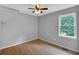Neutral bedroom with a view of the greenery outside at 33 Moriah Ne Way, Rydal, GA 30171