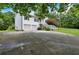 Side angle of home featuring a spacious driveway and neat, attractive landscaping at 33 Moriah Ne Way, Rydal, GA 30171