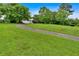 Beautiful front yard with a curved driveway and a well-manicured lawn leading to the home at 33 Moriah Ne Way, Rydal, GA 30171