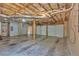 This unfinished garage has 2 garage doors and exposed pipes and rafters at 33 Moriah Ne Way, Rydal, GA 30171