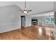 Inviting open floor plan featuring hardwood floors, a fireplace and a vaulted ceiling at 33 Moriah Ne Way, Rydal, GA 30171