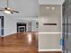 Bright, open living room with hardwood floors, a fireplace, and a ceiling fan at 33 Moriah Ne Way, Rydal, GA 30171