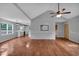 Spacious living room with hardwood floors, vaulted ceilings, and an open layout that leads to the kitchen at 33 Moriah Ne Way, Rydal, GA 30171