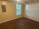 Bedroom featuring plush carpeting, a window with natural light, and neutral wall paint at 5000 Saxony Ct, Stone Mountain, GA 30083