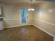 Cozy dining area featuring a classic light fixture and access to the backyard at 5000 Saxony Ct, Stone Mountain, GA 30083