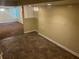 Spacious living room featuring tiled flooring in the foreground and carpet in the background at 5000 Saxony Ct, Stone Mountain, GA 30083