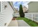 Charming backyard enclosed by a classic white picket fence with a small deck at 747 Gardenside Se Cir, Marietta, GA 30067
