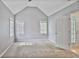 Spacious carpeted bedroom with high ceilings and two windows offers a bright and airy atmosphere at 747 Gardenside Se Cir, Marietta, GA 30067