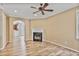 This living room with wood floors boasts an open floor plan, connecting living spaces for easy entertaining and relaxation at 747 Gardenside Se Cir, Marietta, GA 30067