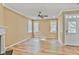 Bright living room boasts wood flooring, a fireplace, ceiling fan, and natural light from multiple windows at 747 Gardenside Se Cir, Marietta, GA 30067