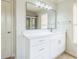 Elegant bathroom featuring modern vanity, a large mirror with decorative lights, and a walk-in shower at 296 Water Oak Pl, Alpharetta, GA 30009