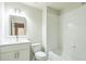 Sparkling clean white bathroom features a shower and tub at 296 Water Oak Pl, Alpharetta, GA 30009