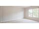 Cozy bedroom with neutral walls, carpet, and a window offering natural light at 296 Water Oak Pl, Alpharetta, GA 30009