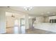 Spacious open-concept living space featuring hardwood floors, neutral walls, recessed lights, and an open staircase at 296 Water Oak Pl, Alpharetta, GA 30009