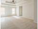 Spacious main bedroom with tray ceilings, neutral walls, carpet floors and natural light from window at 296 Water Oak Pl, Alpharetta, GA 30009