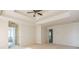 Bright main bedroom boasting tray ceilings, carpet floors, and an ensuite bathroom at 296 Water Oak Pl, Alpharetta, GA 30009
