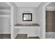 Bathroom featuring a seated vanity space with cabinet storage and a tiled stand-up shower at 2972 Parc Lorraine, Lithonia, GA 30038