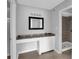 Bathroom featuring a seated vanity space with cabinet storage and a tiled stand-up shower at 2972 Parc Lorraine, Lithonia, GA 30038
