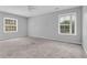 Open bedroom with carpeting, a ceiling fan, and multiple windows providing ample natural light at 2972 Parc Lorraine, Lithonia, GA 30038