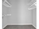 A walk-in closet featuring shelving for storing clothes and other items at 2972 Parc Lorraine, Lithonia, GA 30038