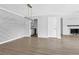 Open dining space with modern chandelier and views to the kitchen and living room at 2972 Parc Lorraine, Lithonia, GA 30038