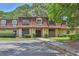Inviting condo complex with mature trees, manicured landscaping, and ample parking at 2972 Parc Lorraine, Lithonia, GA 30038