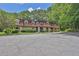 Inviting condo complex with mature trees, manicured landscaping, and ample parking at 2972 Parc Lorraine, Lithonia, GA 30038