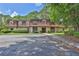 Inviting condo complex with mature trees, manicured landscaping, and ample parking at 2972 Parc Lorraine, Lithonia, GA 30038