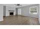 Bright living room with fireplace, ceiling fan, a window, and French doors to the exterior at 2972 Parc Lorraine, Lithonia, GA 30038
