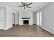 Living room with a fireplace, ceiling fan, and French doors to the exterior at 2972 Parc Lorraine, Lithonia, GA 30038