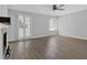 Spacious living room with a fireplace, French doors, neutral paint and a ceiling fan at 2972 Parc Lorraine, Lithonia, GA 30038