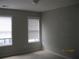 Bedroom featuring carpet and lots of natural light from two large windows at 2975 Wintercrest Trce, Dunwoody, GA 30360