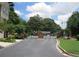 Gated community entrance with brick pillars and lush landscaping, offering security and curb appeal at 2975 Wintercrest Trce, Dunwoody, GA 30360