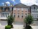 Attractive townhome features brick facade, garage, manicured landscaping and plenty of natural light at 2975 Wintercrest Trce, Dunwoody, GA 30360