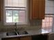 Kitchen with stone countertops, double sink, stainless steel faucet, and lots of natural light at 2975 Wintercrest Trce, Dunwoody, GA 30360