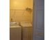 Convenient laundry area with washer, dryer, and shelving at 2975 Wintercrest Trce, Dunwoody, GA 30360