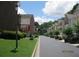 A well maintained street view featuring sidewalks, grass lawns, and meticulously arranged shrubbery at 2975 Wintercrest Trce, Dunwoody, GA 30360