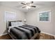 Bedroom with hardwood floors and modern ceiling fan offering natural light creates a peaceful atmosphere at 86 Stratford Nw Dr, Atlanta, GA 30311