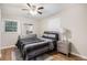 Stylish bedroom features a modern ceiling fan, hardwood floors, and coordinated furniture for a serene retreat at 86 Stratford Nw Dr, Atlanta, GA 30311