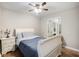 This cozy bedroom features a ceiling fan, hardwood floors, and a vanity, making it feel like home at 86 Stratford Nw Dr, Atlanta, GA 30311