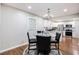 Cozy dining area with modern lighting fixtures and a view of the kitchen and stainless steel appliances at 86 Stratford Nw Dr, Atlanta, GA 30311