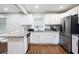 Beautiful kitchen features stainless steel appliances, granite countertops, and white cabinetry for a modern, stylish design at 86 Stratford Nw Dr, Atlanta, GA 30311