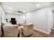 Open-concept living room with hardwood floors and neutral colors, illuminated by recessed lighting and natural light at 86 Stratford Nw Dr, Atlanta, GA 30311