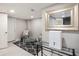 Living room area with tiled floors, large framed mirror, decorative chairs, and a glass coffee table at 86 Stratford Nw Dr, Atlanta, GA 30311